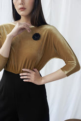 Soft velvet blouse with boat neckline and fitted silhouette for elegant occasion wear